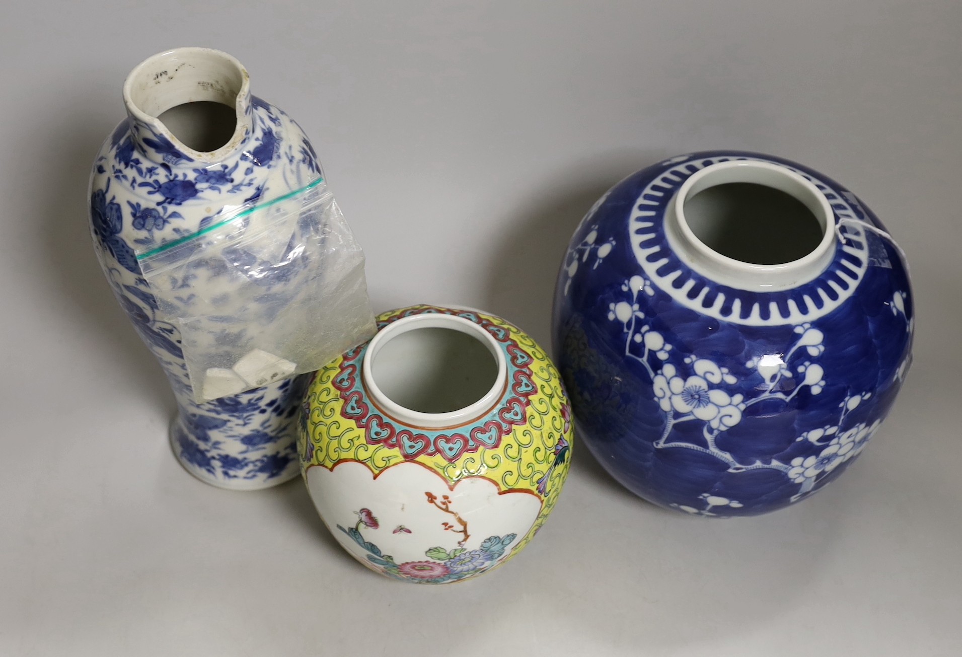 A 19th century Chinese blue and white ‘birds and flowers’ baluster vase, a blue and white jar and a famille rose jar